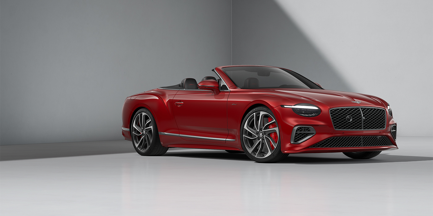 Bentley Hannover Bentley Continental GTC Speed convertible in Dragon Red paint and 22" swept spoke wheels - front 3/4