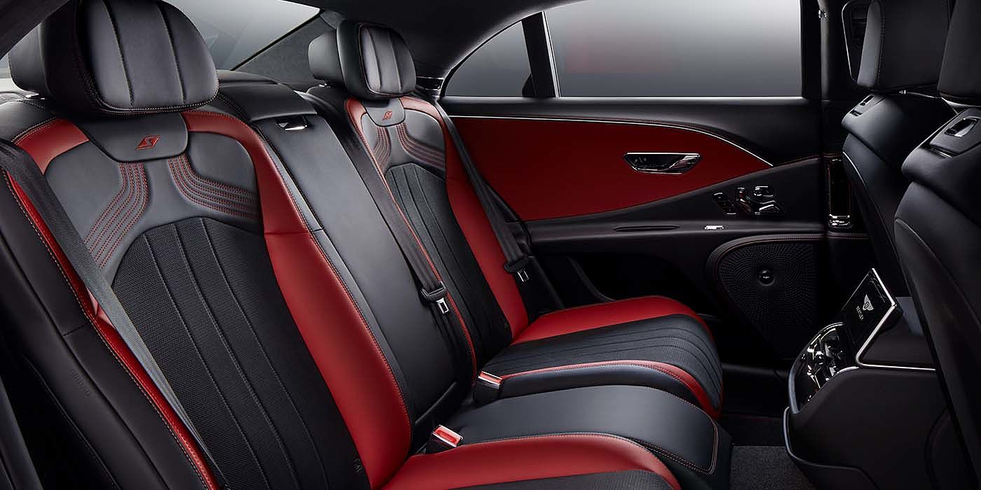 Bentley Hannover Bentley Flying Spur S sedan rear interior in Beluga black and Hotspur red hide with S stitching