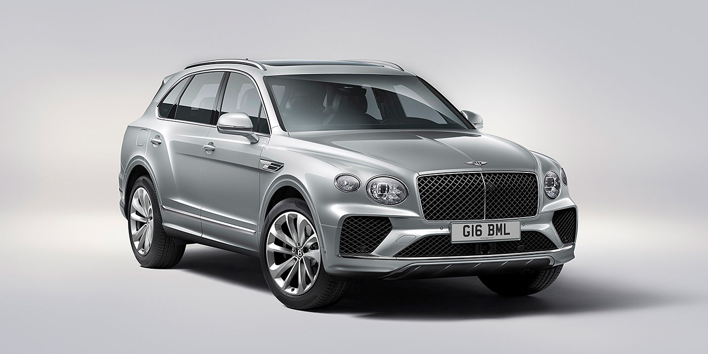 Bentley Hannover Bentley Bentayga in Moonbeam paint, front three-quarter view, featuring a matrix grille and elliptical LED headlights.