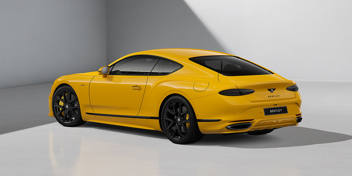 Bentley Hannover Bentley Continental GT Speed coupe in Monaco Yellow paint and 22" Ten spoke sport wheels - rear 3/4
