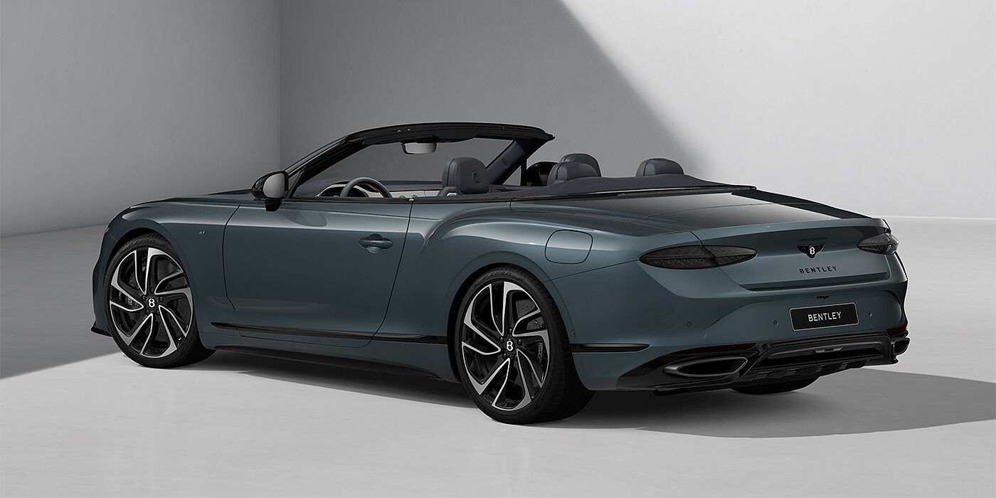 Bentley Hannover Bentley Continental GTC S convertible in Thunder blue paint and 22" ten spoke wheels rear 3/4