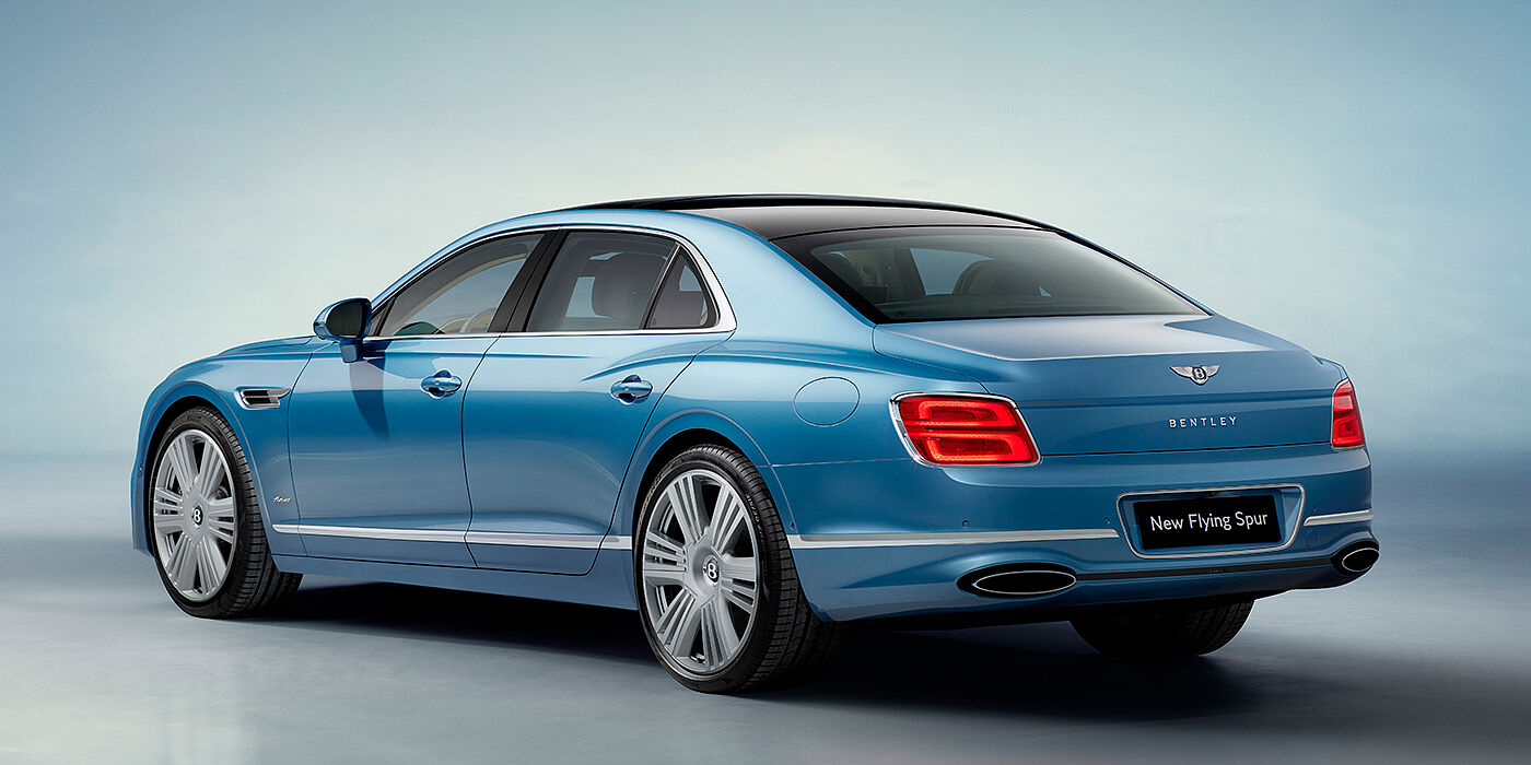 Bentley Hannover New Bentley Flying Spur Azure sedan rear view in Light windsor blue by Mulliner paint with 22 inch Azure wheels and chrome exterior details