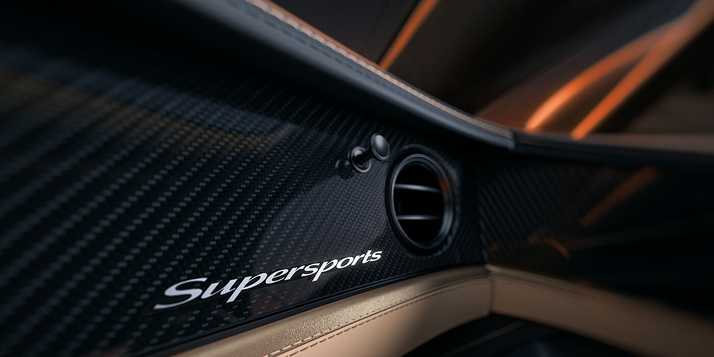 Bentley Hannover Bentley Supersports front interior high gloss black carbon fibre veneer detail with Supersports badge
