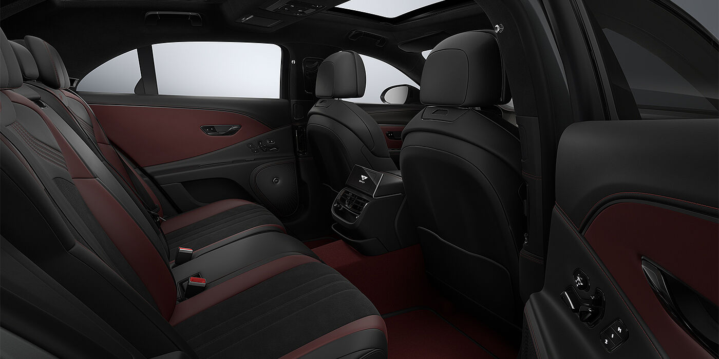 Bentley Hannover New Bentley Flying Spur S sedan rear interior in Cricket Ball red  and Beluga black hides with High Gloss Carbon Fibre veneer