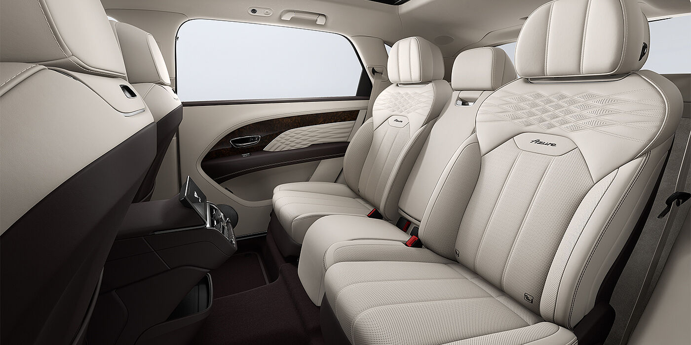 Bentley Hannover Bentley Bentayga EWB Azure SUV rear interior in Linen and Burnt Oak hides and Azure seat stitching
