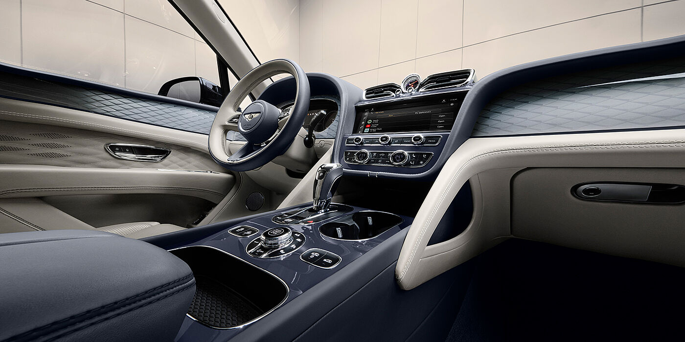 Bentley Hannover Bentley Bentayga Atelier Edition SUV front interior in Linen and Imperial Blue hides with Dark Tint Diamond Brushed Aluminium veneer