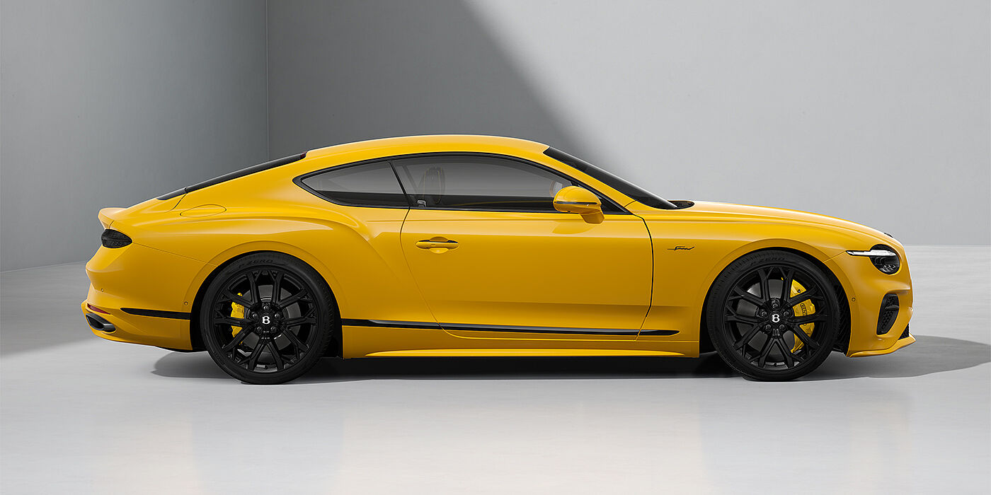 Bentley Hannover Bentley Continental GT Speed coupe in Monaco Yellow paint and 22" Ten spoke sport wheels - profile