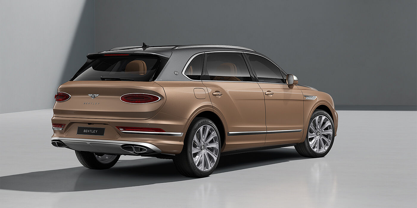 Bentley Hannover Bentley Bentayga EWB Mulliner SUV in Magnetic and Rose Gold paint and 22" Mulliner wheels rear ¾
