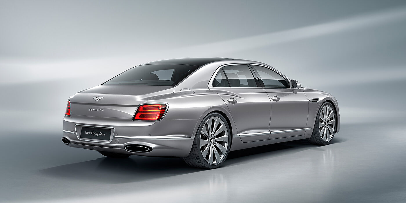 Bentley Hannover New Bentley Flying Spur sedan rear view in Silverlake paint with ten spoke wheels and chrome matrix grille