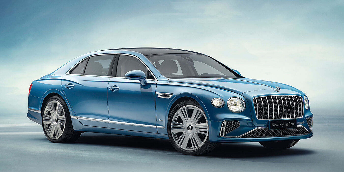 Bentley Hannover New Bentley Flying Spur Azure sedan front view in Light windsor blue by Mulliner paint with 22 inch Azure wheels and chrome exterior details