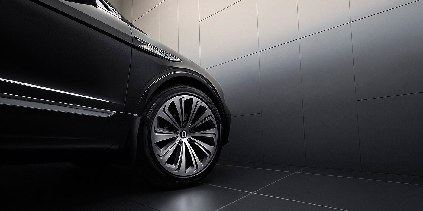Bentley Hannover Bentley Bentayga Atelier Edition SUV in Onyx black paint front side detail with 22 inch 10 spoke wheel