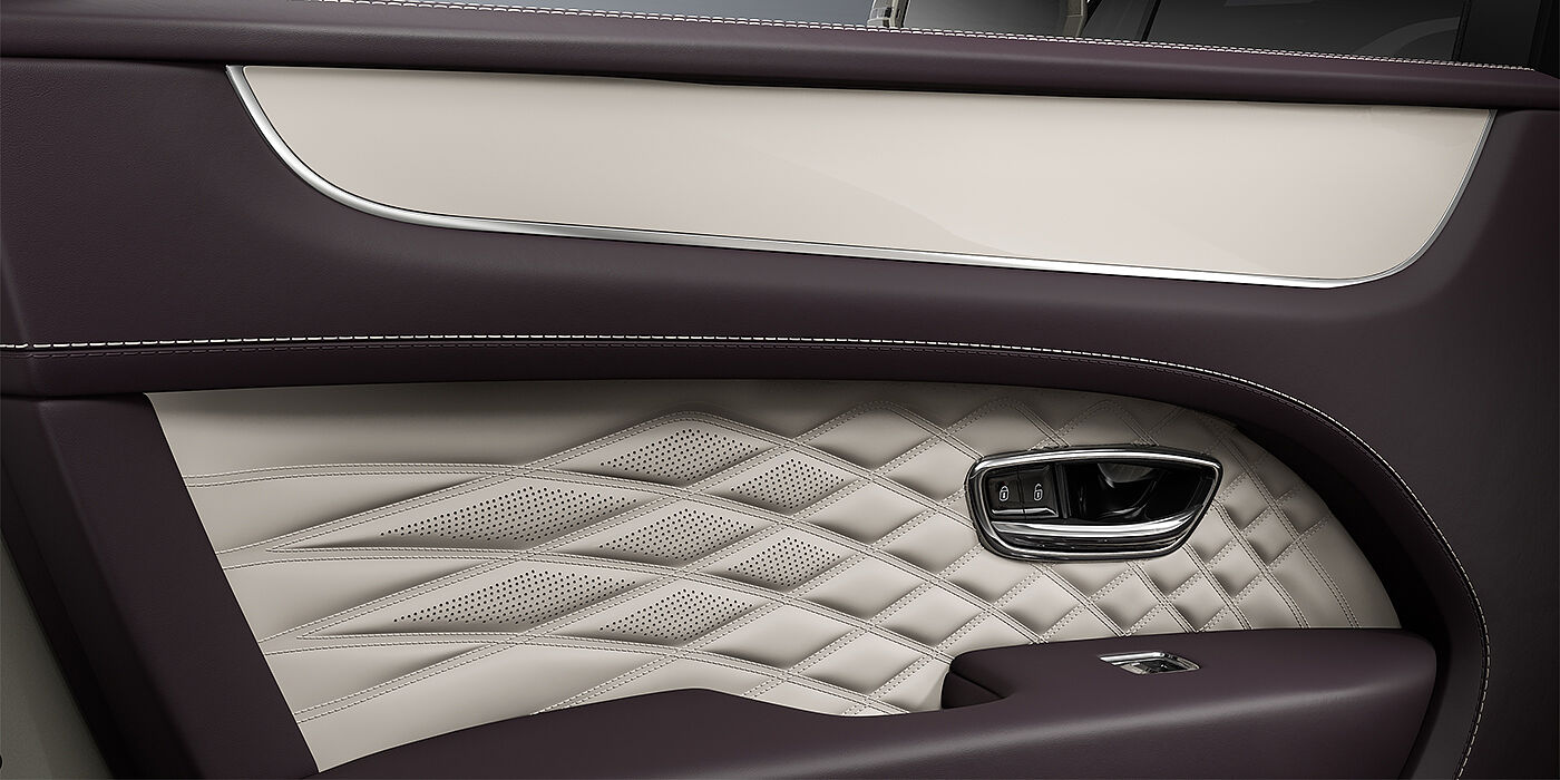Bentley Hannover Bentley Bentayga EWB Azure SUV door interior detail in Linen and Damson hides with Piano Linen veneer