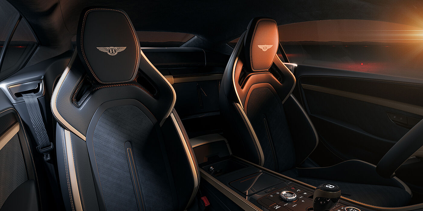 Bentley Hannover Bentley Supersports rear interior with Supersports seats in Camel and Beluga black hides hide and high gloss carbon fibre veneer