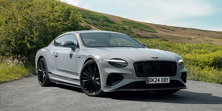 Bentley Hannover Bentley Continental GT front three quarter with Carbon Fibre Specification parked on road.