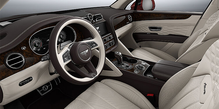 Bentley Hannover Bentley Bentayga EWB Azure SUV front interior in Linen and Burnt Oak hides with Dark Stained Burr Walnut veneer