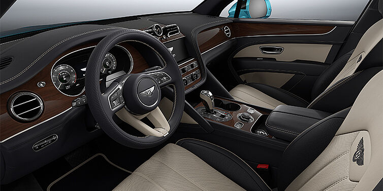 Bentley Hannover Bentley Bentayga EWB SUV front interior in Portland and Imperial Blue hides with Crown Cut Walnut veneer