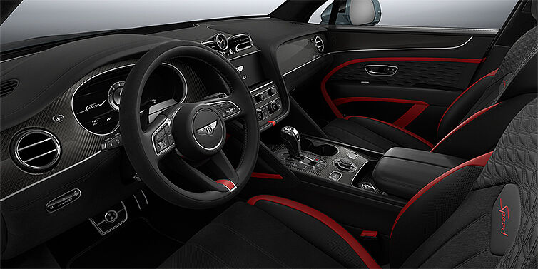 Bentley Hannover Bentley Bentayga Speed SUV front interior in Pillar Box Red and Beluga black hides with Carbon Fibre veneer