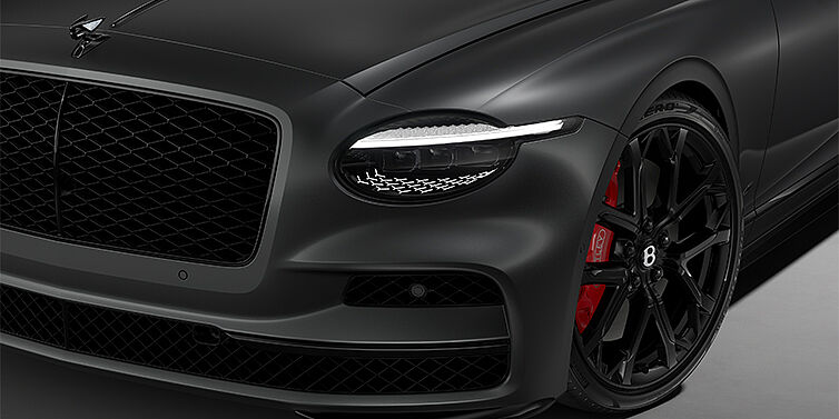 Bentley Hannover New Bentley Flying Spur S sedan head lamp against Anthracite Satin paint with  22" Sports wheel