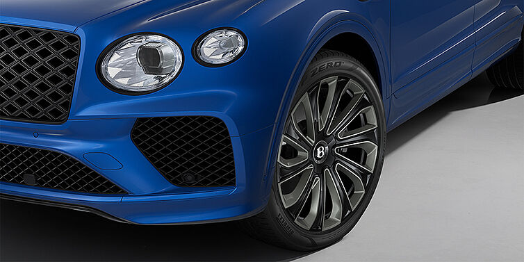 Bentley Hannover Bentley Bentayga Artenara Edition SUV front detail in Sequin Blue paint and 22" Mulliner Gloss Black wheels front 3/4