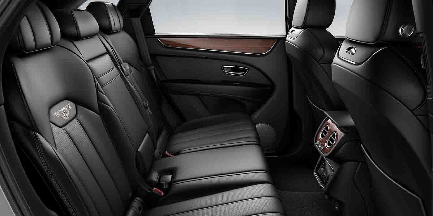 Bentley Hannover Bentley Bentayga EWB interior view for rear passengers with Beluga black hide.