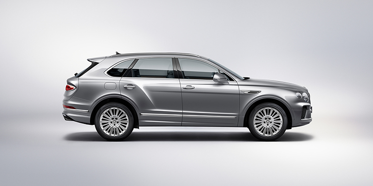 Bentley Hannover Bentley Bentayga SUV side profile in Moonbeam silver paint against white background featuring 21 inch 5 spoke wheels