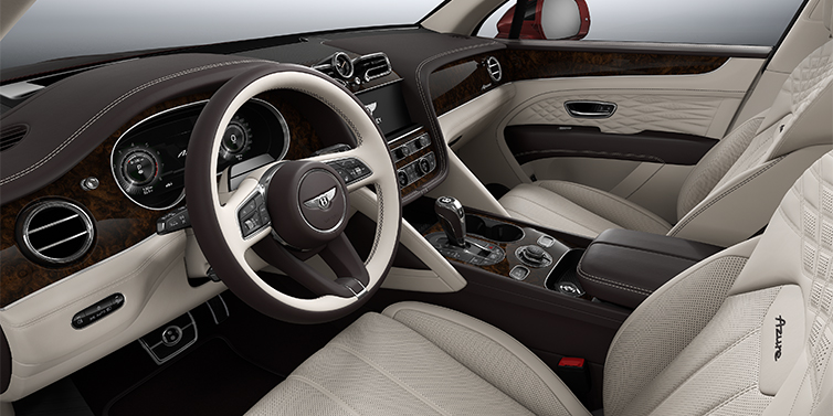 Bentley Hannover Bentley Bentayga EWB Azure SUV front interior in Linen and Burnt Oak hides with Dark Stained Burr Walnut veneer