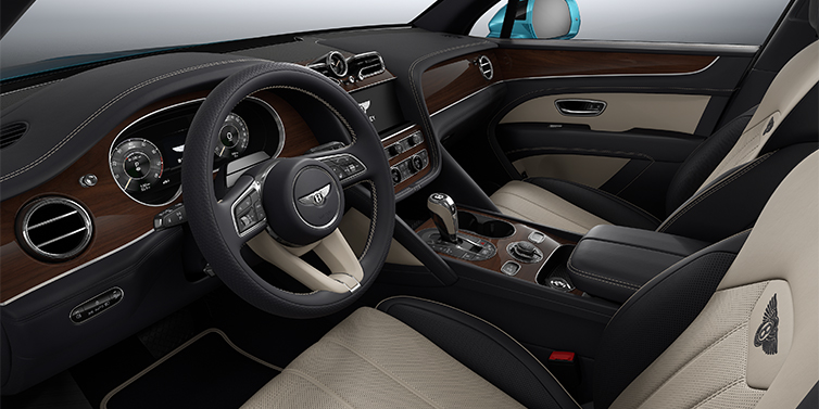Bentley Hannover Bentley Bentayga EWB SUV front interior in Portland and Imperial Blue hides with Crown Cut Walnut veneer