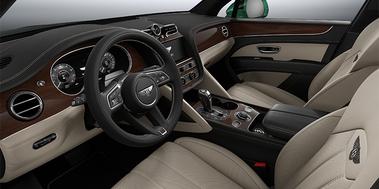 Bentley Hannover Bentley Bentayga SUV front interior in Portland and Beluga black hides with Crown Cut Walnut veneer