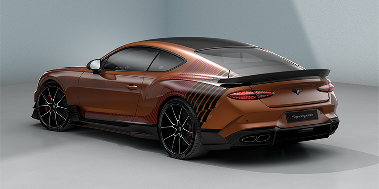 Bentley Hannover Bentley Supersports rear three quarter in "Meteorite" Design theme with Orange Flame paint and Beluga Black and Candy Red paint stripes across the rear haunch.