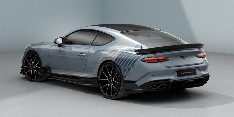 Bentley Hannover Bentley Supersports rear three quarter in "Daybreak" Design theme with Jetstream blue paint and Arctica white and Portofino blue paint stripes across the rear haunch.