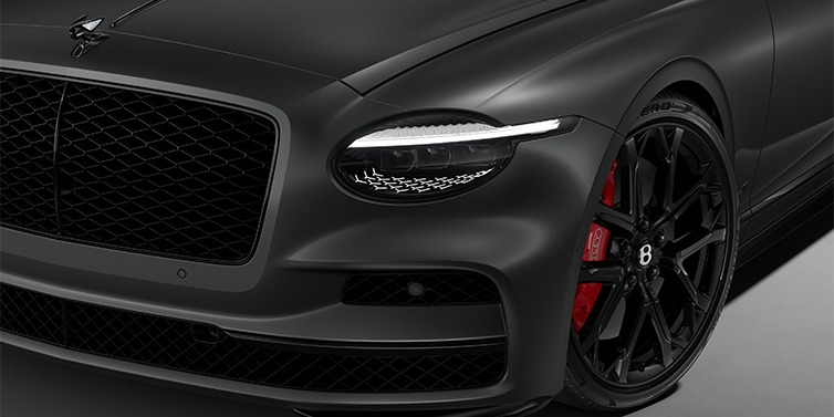 Bentley Hannover New Bentley Flying Spur S sedan head lamp against Anthracite Satin paint with  22" Sports wheel