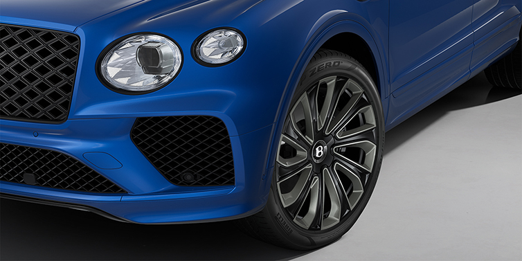 Bentley Hannover Bentley Bentayga Artenara Edition SUV front detail in Sequin Blue paint and 22" Mulliner Gloss Black wheels front 3/4